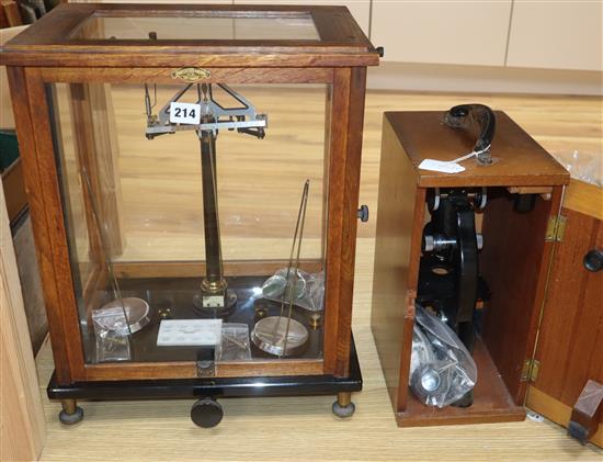 A set of balance scales and a cased Beck microscope
